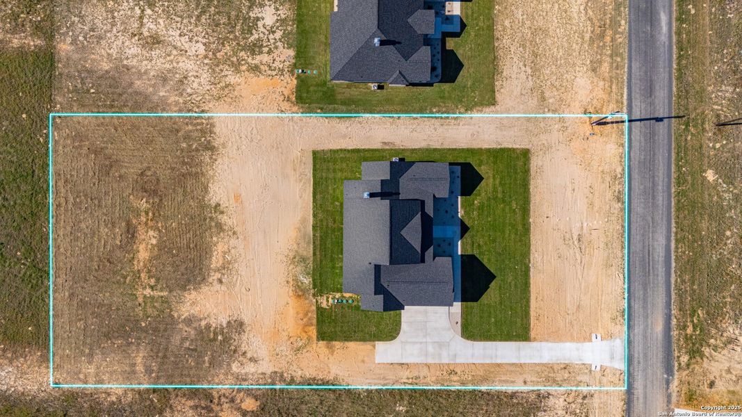 Front exterior of a new home in , La Vernia, TX, highlighting curb appeal (Image 29).