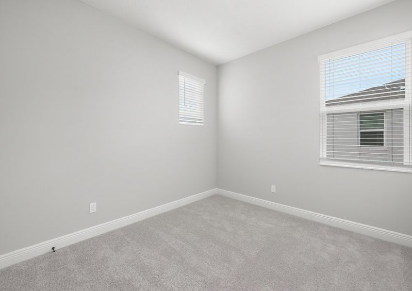 Bedroom with lush carpet flooring