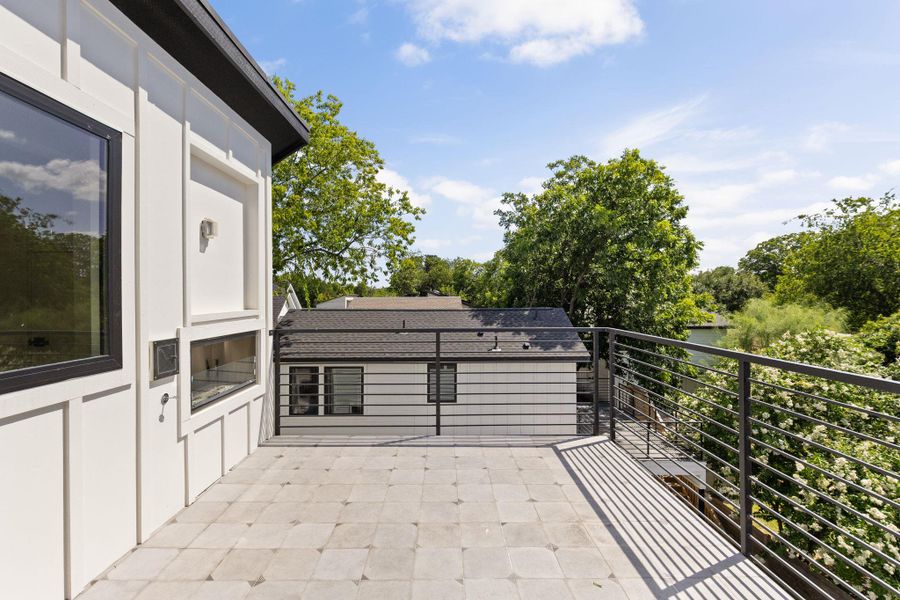 An inviting private patio offers an ideal space for outdoor relaxation amidst verdant surroundings.