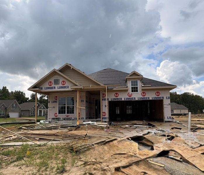 Single-story residence under construction featuring a dormer window Single-story residence under construction featuring a dormer window