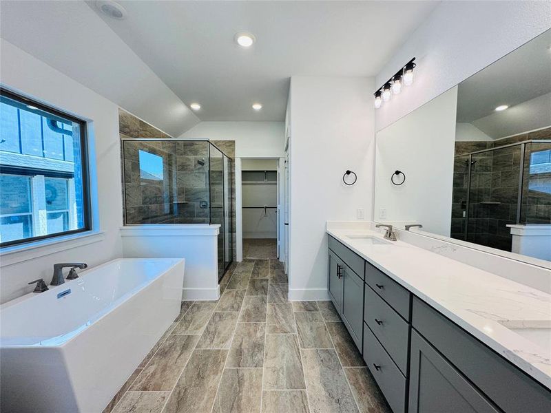 You will love starting or ending your day in this beautiful owner's bath!