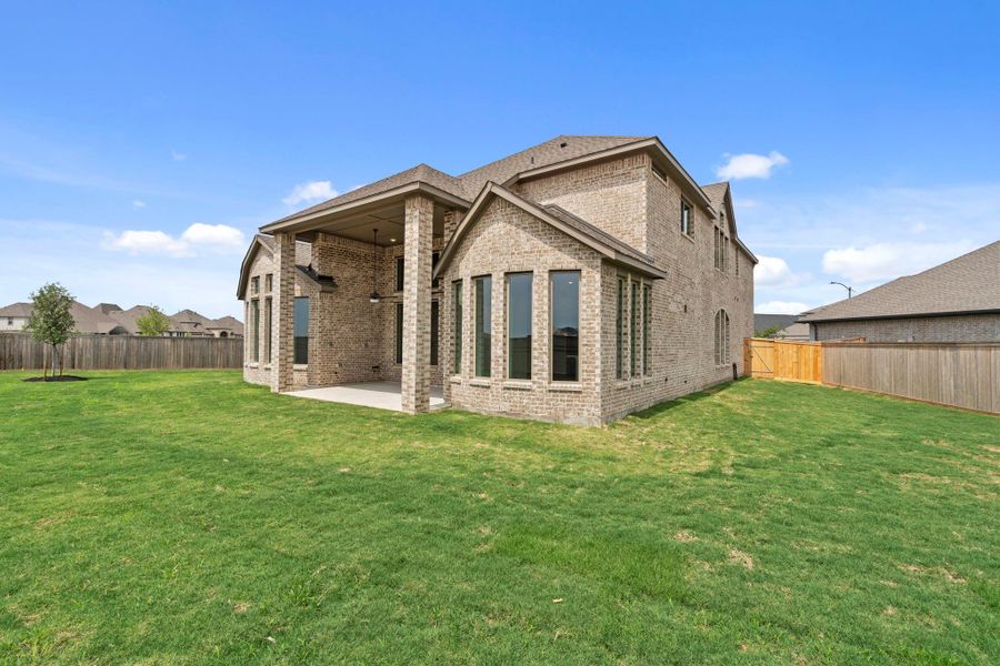 Exterior details and patio area of a home in Bridgeland, Cypress (Image 23).