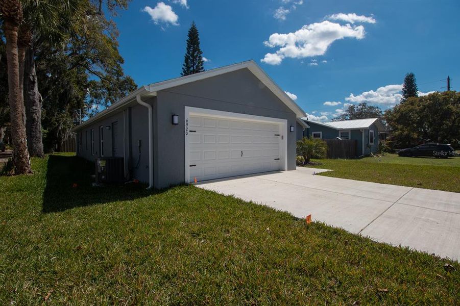Front exterior of a new home in , New Port Richey, FL, highlighting curb appeal (Image 29).