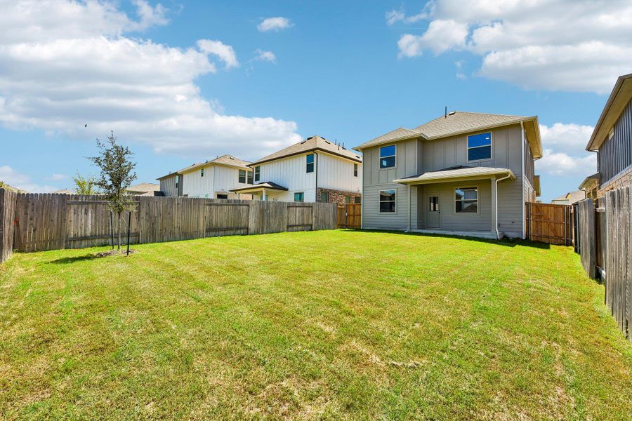 Exterior details and patio area of a home in Crosswinds, Kyle (Image 20).