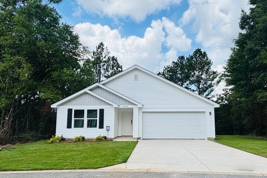Front exterior of a new home in Meadow Creek, Crestview, FL, highlighting curb appeal (Image 1). Front exterior of a new home in Meadow Creek, Crestview, FL, highlighting curb appeal (Image 1).