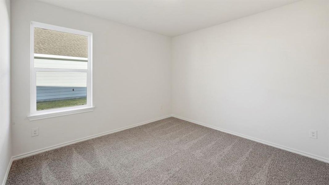 Empty room featuring carpet floors and baseboards Empty room featuring carpet floors and baseboards