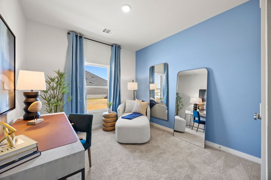 A living room with a blue wall. A living room with a blue wall.