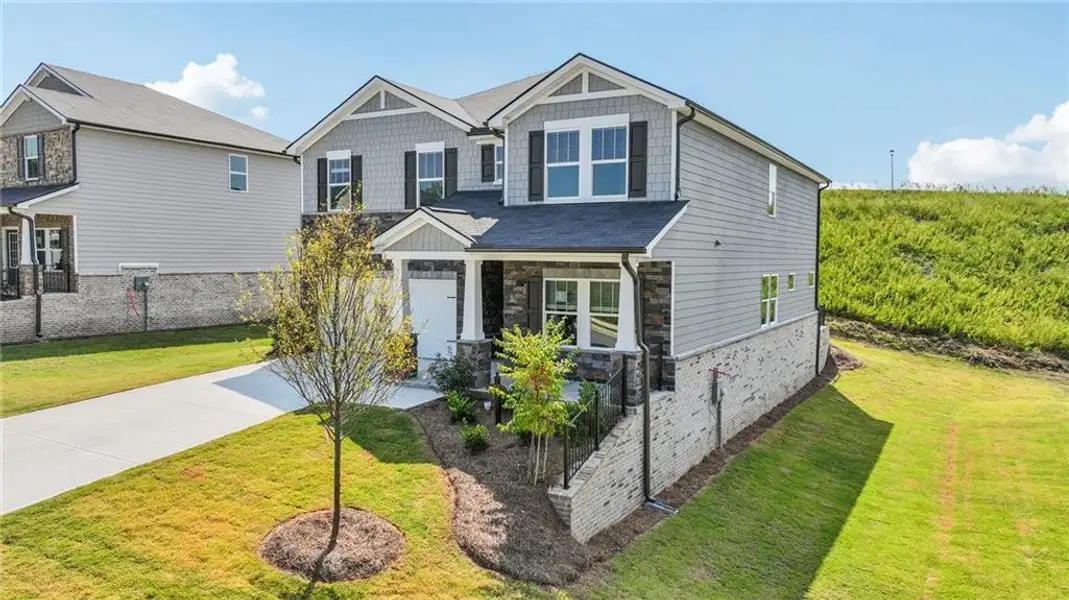 Exterior details and patio area of a home in Preserve at Mountain Creek, Pendergrass (Image 2).