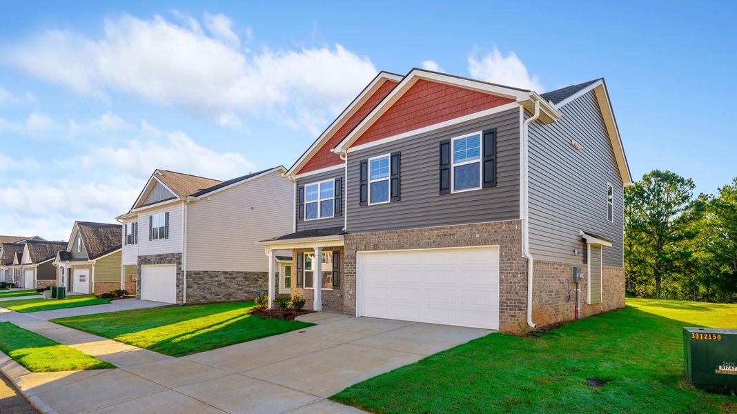 Front exterior of a new home in Price's Crossing, LaFayette, GA, highlighting curb appeal (Image 2). Front exterior of a new home in Price's Crossing, LaFayette, GA, highlighting curb appeal (Image 2).