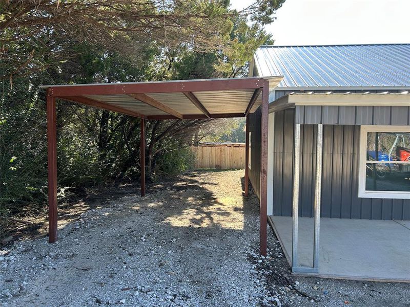 View of car parking with a detached carport View of car parking with a detached carport