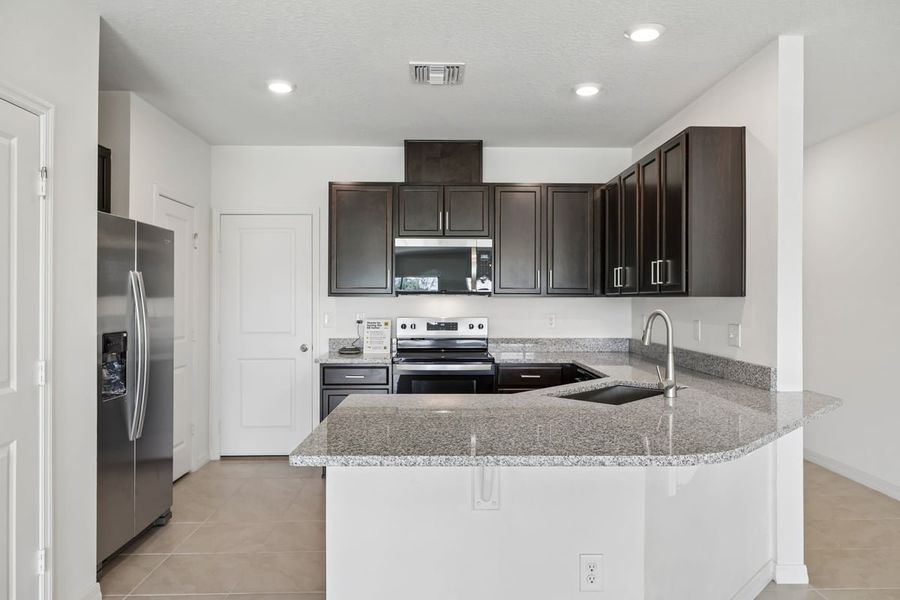 Furnished interior view inside a new home in Reserve at Forest Lake Townhomes, Lake Wales (Image 7).