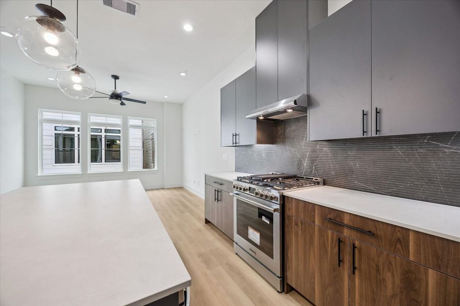 Well-planned kitchen layout with island seating and abundant cabinetry