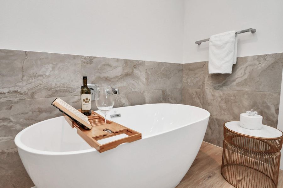 See this beautiful tub in the main bathroom. Thoughtful details and refined finishes enhance the space, creating a sophisticated yet inviting atmosphere. See this beautiful tub in the main bathroom. Thoughtful details and refined finishes enhance the space, creating a sophisticated yet inviting atmosphere.
