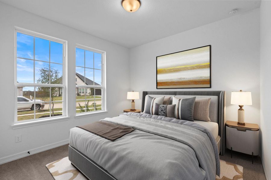 Your secondary bedroom features plush carpet, fresh paint, closet, and a large window that lets in plenty of natural lighting.