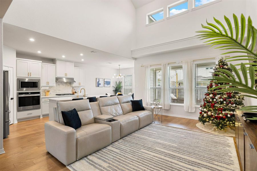 The living room rises to 20' ceilings that immediately open the space and draw your eyes upward