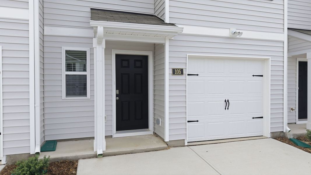Exterior details and patio area of a home in The Townes at Hunter Hill, Rocky Mount (Image 3).