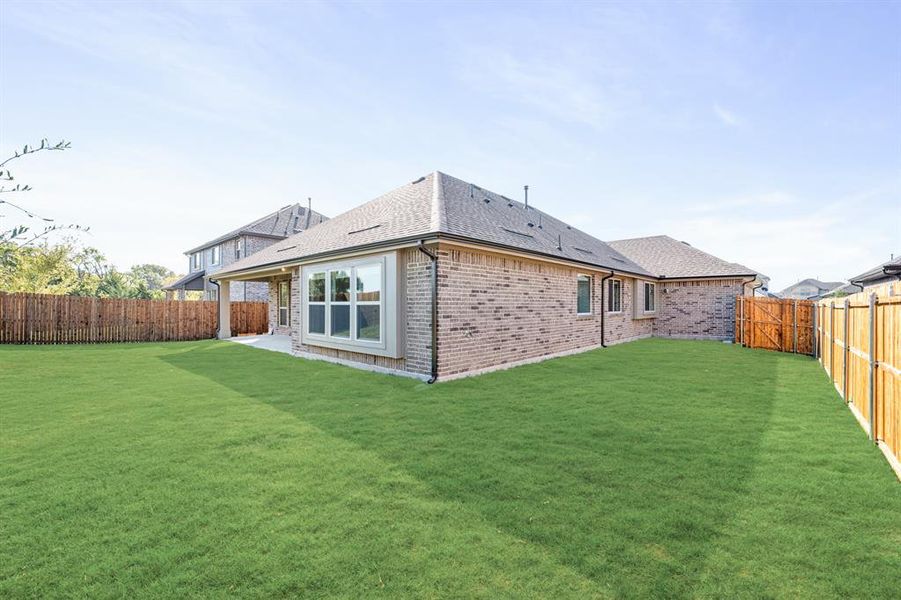 Exterior details and patio area of a home in West Crossing, Anna (Image 2). Exterior details and patio area of a home in West Crossing, Anna (Image 2).