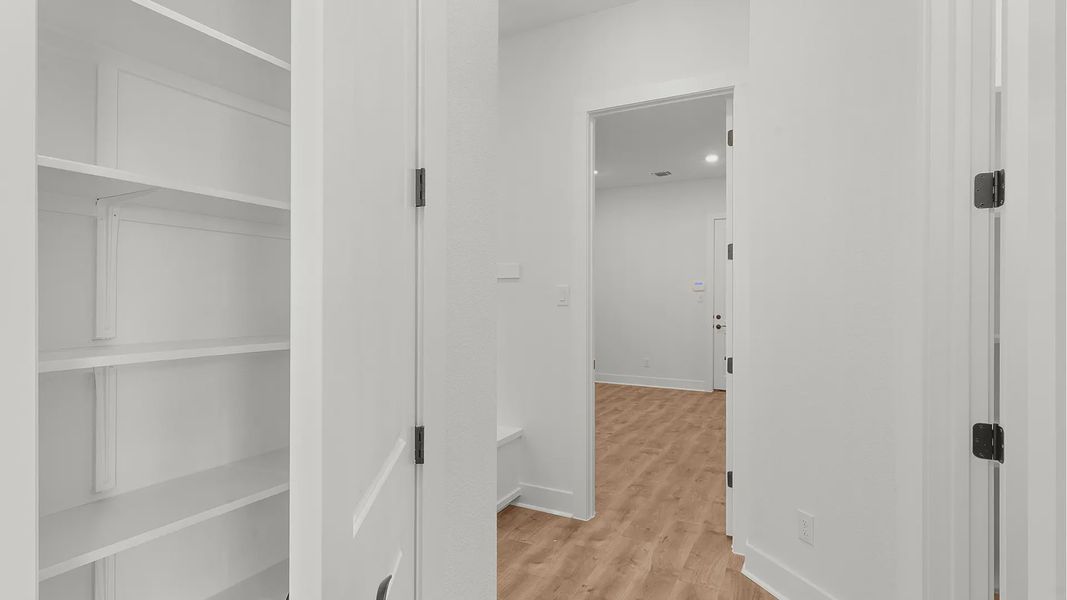 Representative unfurnished interior of a home built from the Drios by Chesmar Homes in Berry Creek Highlands, Georgetown (Image 22).