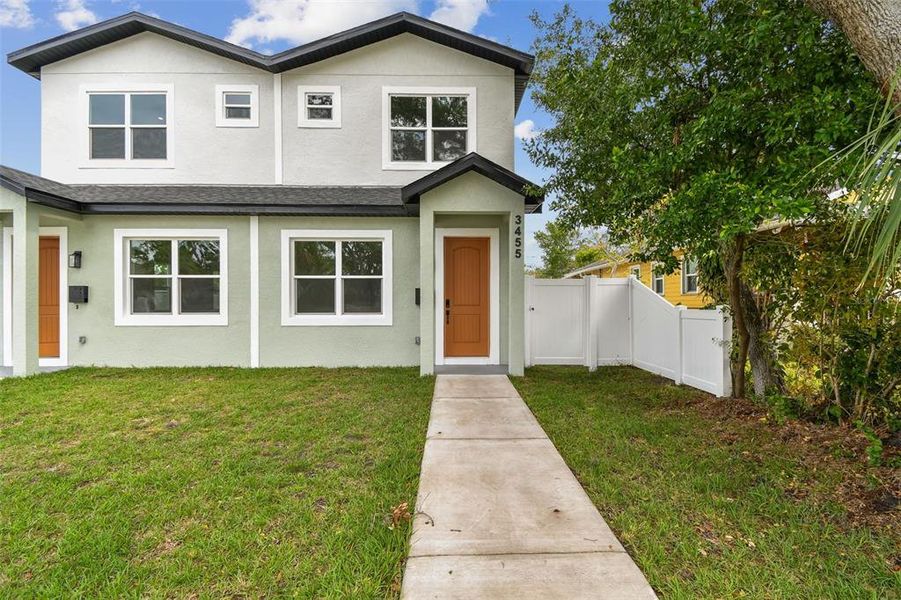 Front exterior of a new home in , St. Petersburg, FL, highlighting curb appeal (Image 1). Front exterior of a new home in , St. Petersburg, FL, highlighting curb appeal (Image 1).