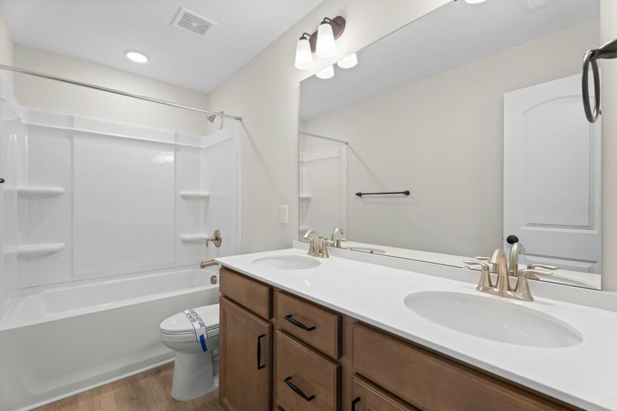 Furnished interior view inside a new home in Cottages at Piper Village, Trinity (Image 12).