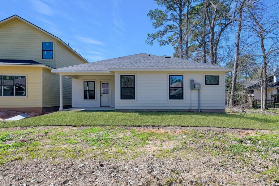 This move-in-ready home offers a low-maintenance exterior and a scenic backdrop of mature trees, providing a perfect blend of privacy and community.
