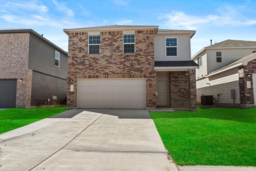 Front exterior of a new home in Sunset Oaks: Ridgepointe Collection, Maxwell, TX, highlighting curb appeal (Image 1). Front exterior of a new home in Sunset Oaks: Ridgepointe Collection, Maxwell, TX, highlighting curb appeal (Image 1).