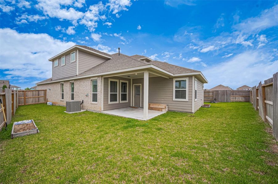 Front exterior of a new home in Sunterra, Katy, TX, highlighting curb appeal (Image 24).