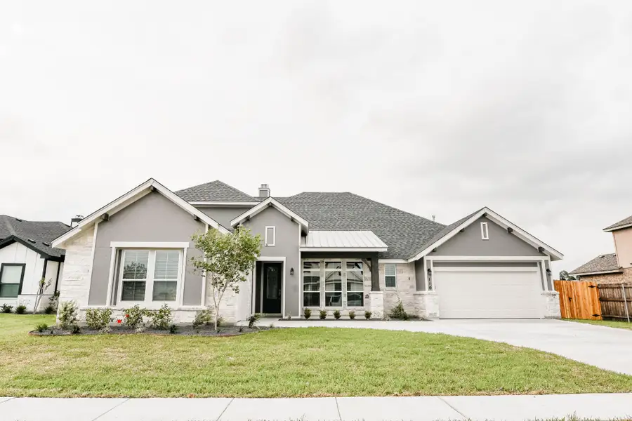 Front exterior of a home in the Escalera Ranch 1833 community, located in Victoria, TX (Image 11).