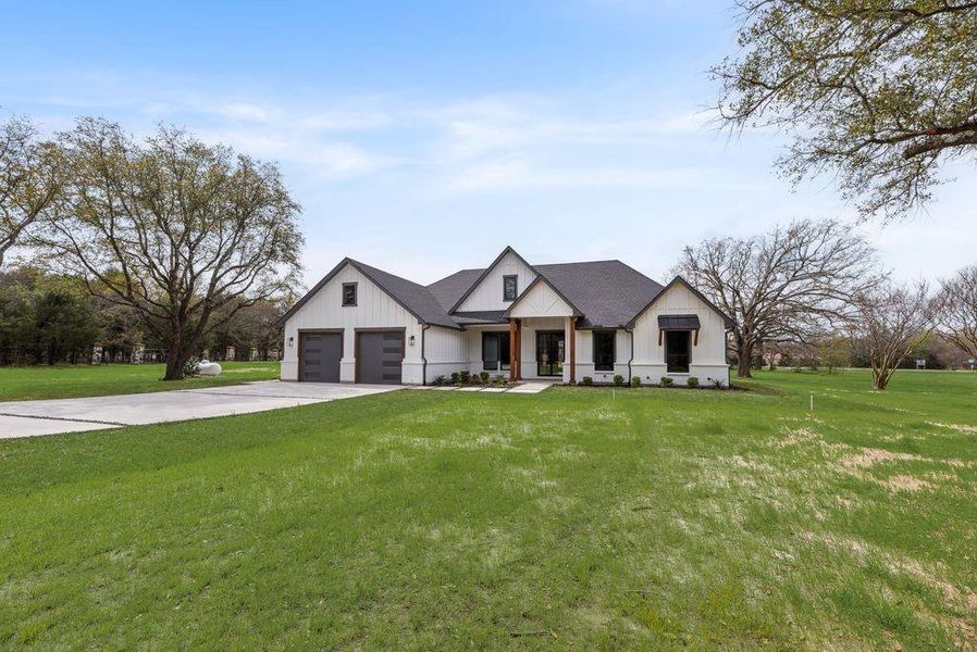 Front exterior of a new home in , Poetry, TX, highlighting curb appeal (Image 22). Front exterior of a new home in , Poetry, TX, highlighting curb appeal (Image 22).