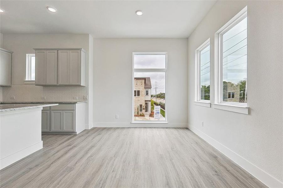 Unfurnished living room with light hardwood / wood-style floors