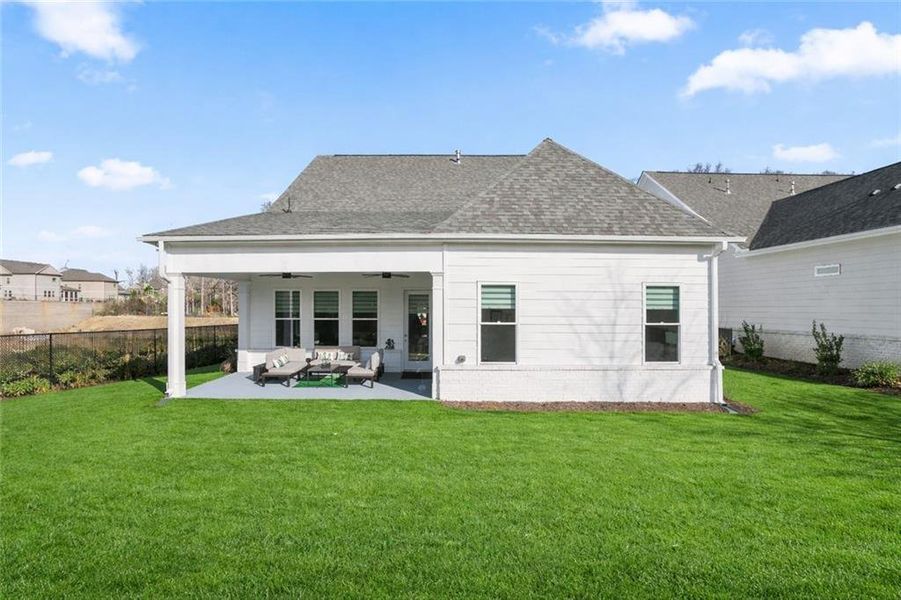 Exterior details and patio area of a home in Courtyards at Traditions, Cumming (Image 24).
