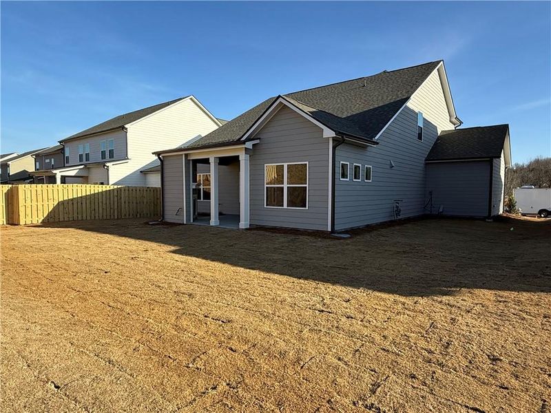 Exterior details and patio area of a home in Ponderosa Farms Manor, Gainesville (Image 23).