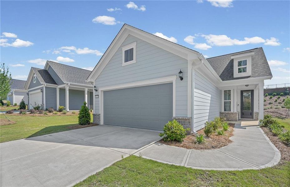 Front exterior of a new home in Del Webb at Lake Oconee, Greensboro, GA, highlighting curb appeal (Image 1). Front exterior of a new home in Del Webb at Lake Oconee, Greensboro, GA, highlighting curb appeal (Image 1).