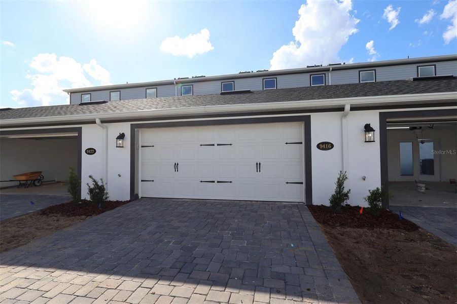 Exterior details and patio area of a home in Tribute at Ovation, Winter Garden (Image 3). Exterior details and patio area of a home in Tribute at Ovation, Winter Garden (Image 3).