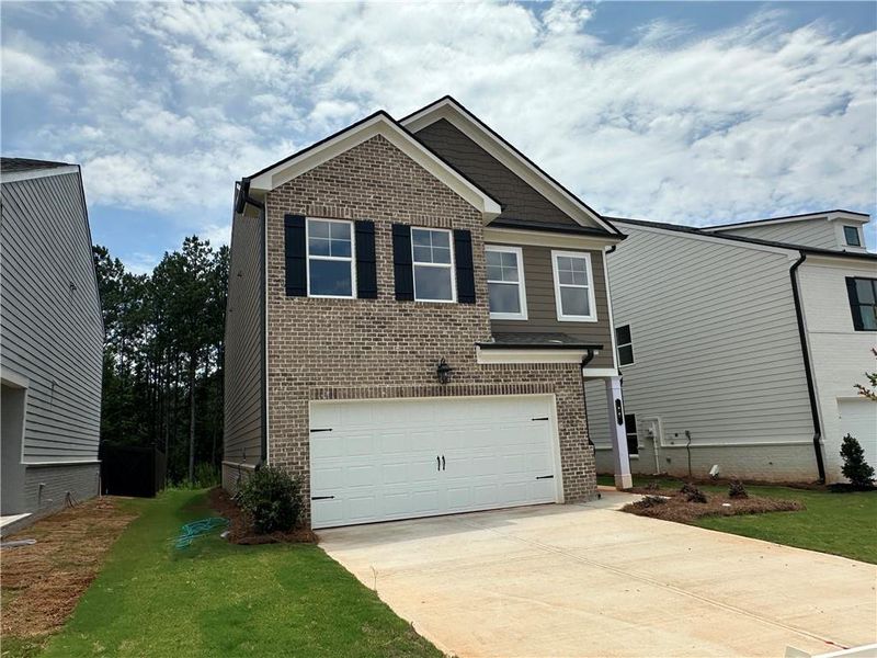 Front exterior of a new home in Kentmere, Auburn, GA, highlighting curb appeal (Image 17).