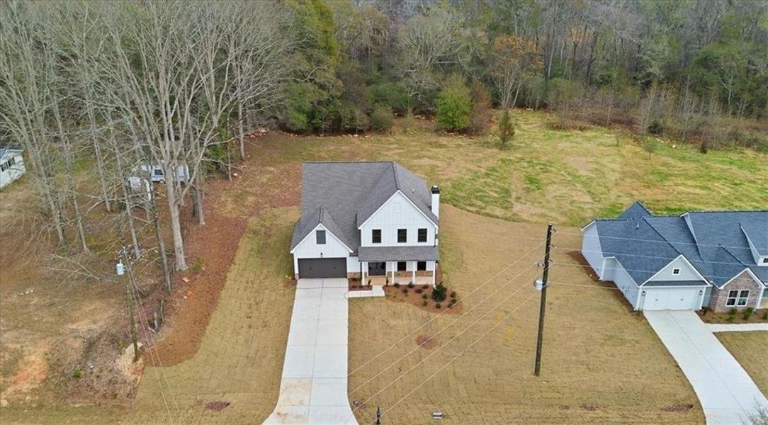 Front exterior of a new home in , Statham, GA, highlighting curb appeal (Image 34).