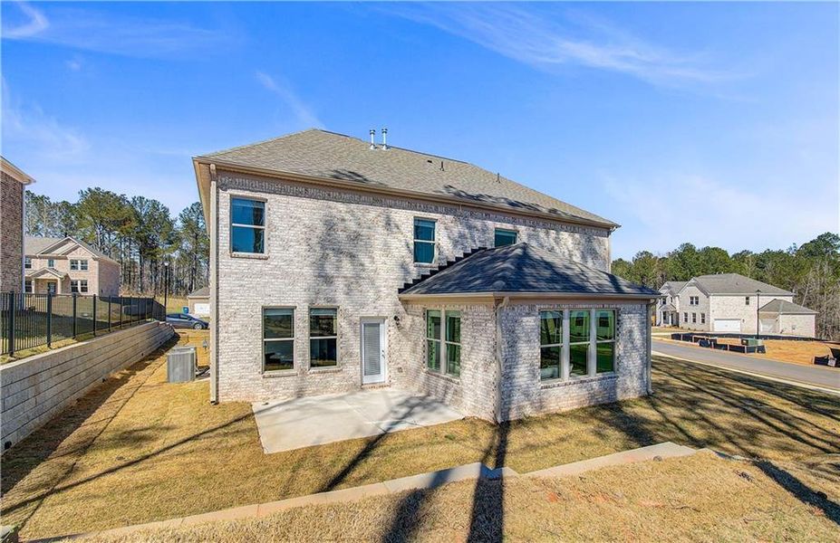 Front exterior of a new home in Trinity Park, McDonough, GA, highlighting curb appeal (Image 22).