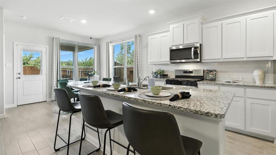 Kitchen - All Home and community information, including pricing, included features, terms, availability and amenities, are subject to change at any time without notice or obligation. All Drawings, pictures, photographs, video, square footages, floor plans, elevations, features, colors and sizes are approximate for illustration purposes only and will vary from the homes as built.