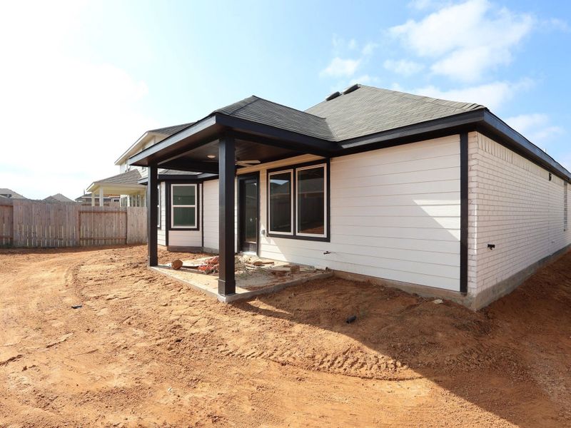 Exterior details and patio area of a home in Magnolia Ridge, Magnolia (Image 14).