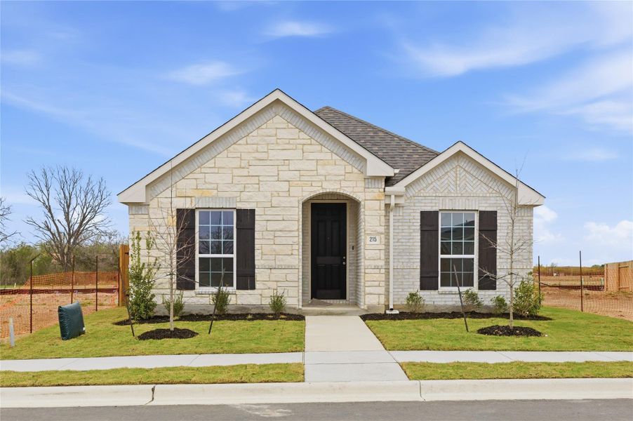 Front exterior of a new home in Infinity Square, Kyle, TX, highlighting curb appeal (Image 2). Front exterior of a new home in Infinity Square, Kyle, TX, highlighting curb appeal (Image 2).