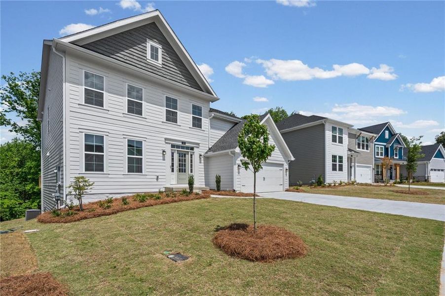 Front exterior of a new home in The Reserve At Liberty Park, Braselton, GA, highlighting curb appeal (Image 22). Front exterior of a new home in The Reserve At Liberty Park, Braselton, GA, highlighting curb appeal (Image 22).