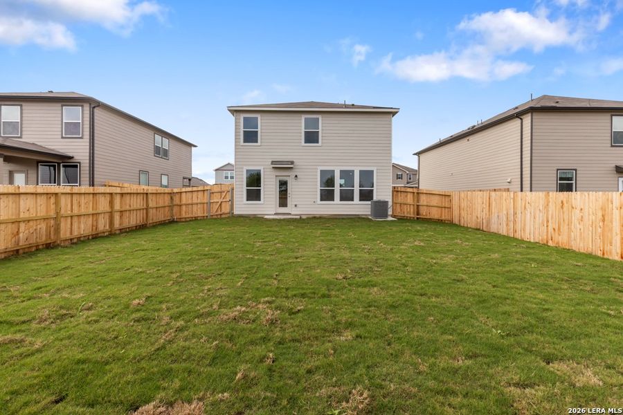 Exterior details and patio area of a home in Woodside Farms, Seguin (Image 19).