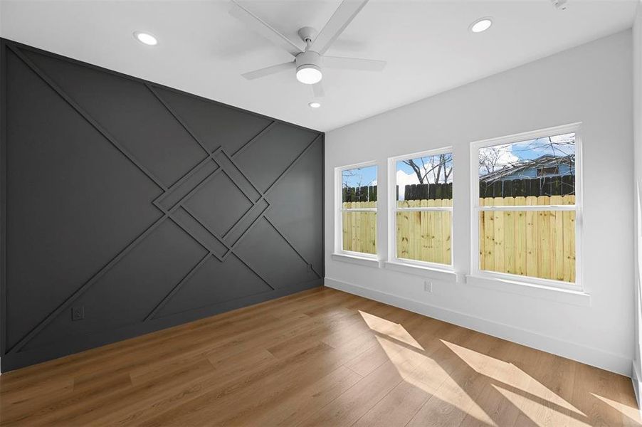 Primary Bedroom with Accent Wall And Lots of Windows!