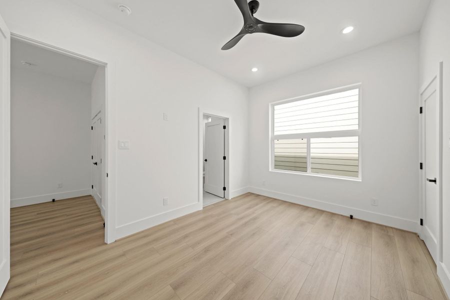 The second bedroom upstairs has an ensuite bath for privacy and access to the laundry room just outside in the hallway.