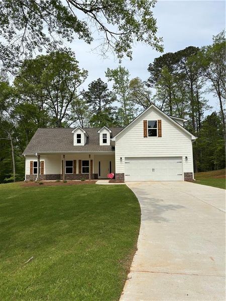 Front exterior of a new home in , Covington, GA, highlighting curb appeal (Image 14). Front exterior of a new home in , Covington, GA, highlighting curb appeal (Image 14).