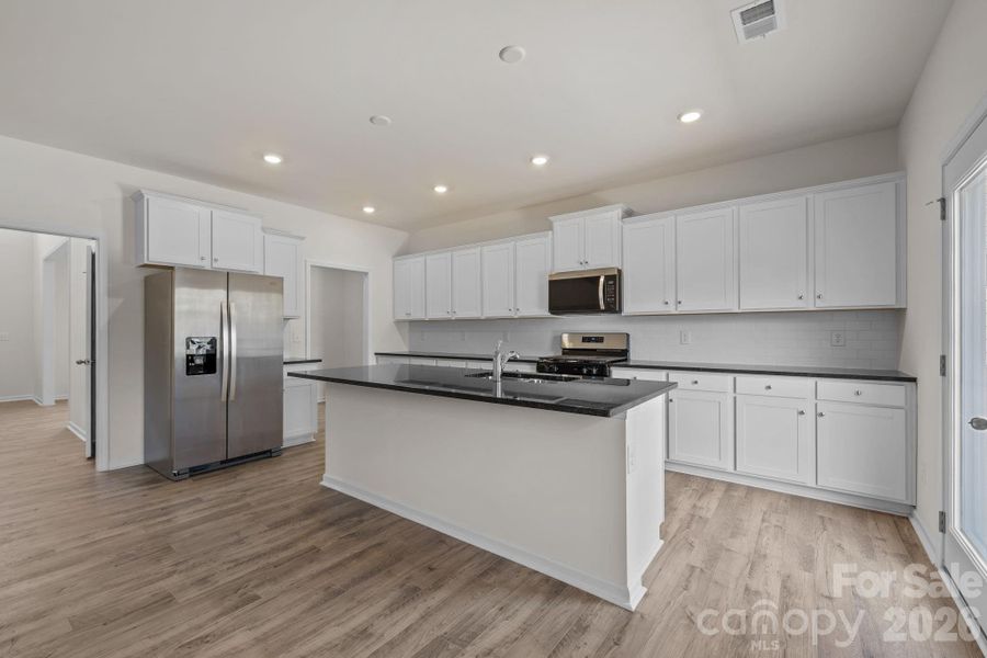 Furnished interior view inside a new home in McFarland Estates, York (Image 7).