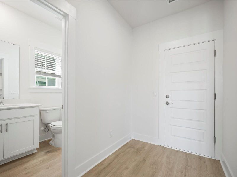 Spacious, unfurnished interior of a new home in The Coves at Lakes of Cane Bay, Summerville (Image 19).