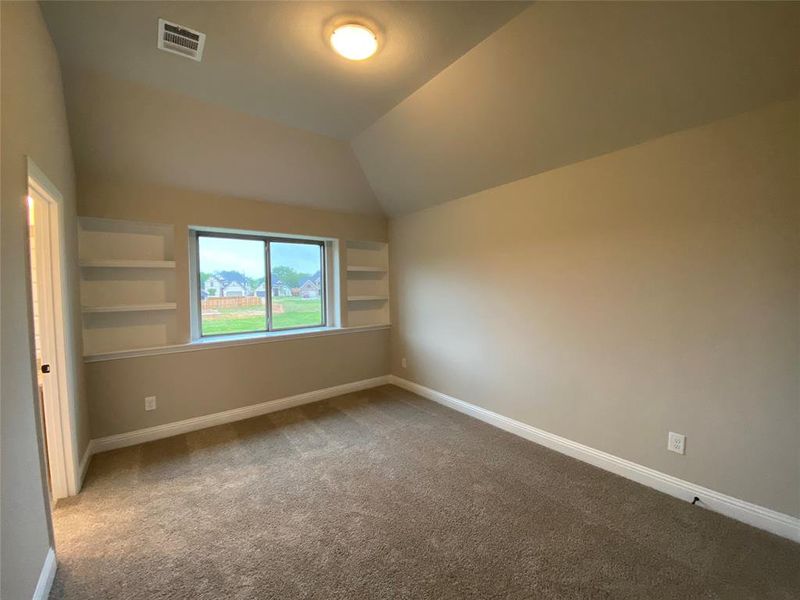 Bed 5 has vaulted ceiling, built-in shelves, and shares a Jack & Jill bath