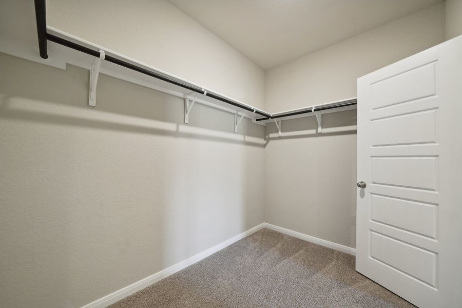 Primary suite walk-in closet in the Matador floorplan in the Meritage Homes community.