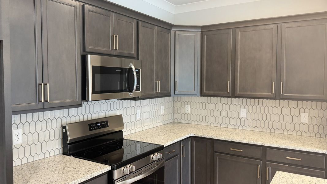Furnished interior view inside a new home in The Greens at Legacy Townhomes, Springfield (Image 5).